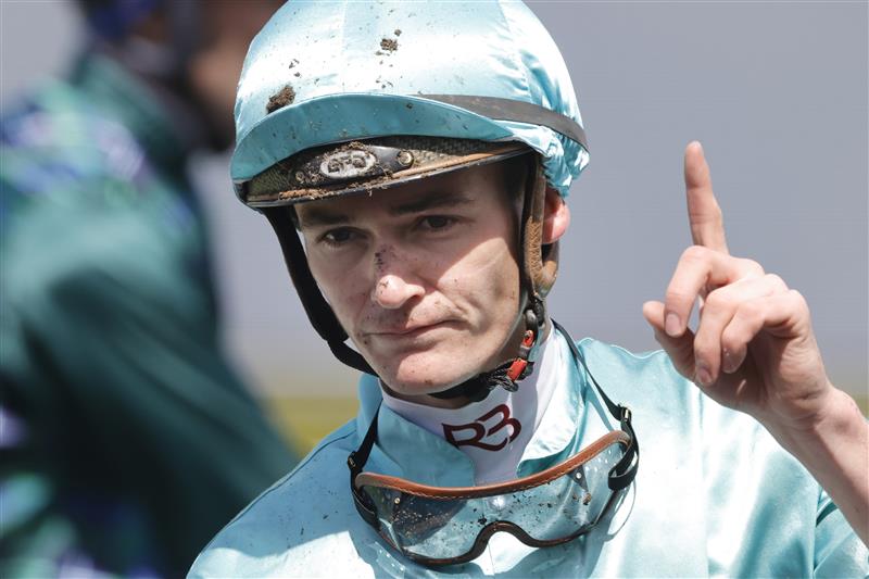 SYDNEY, AUSTRALIA - OCTOBER 01: Regan Bayliss hold up one finger after winning race 2 the Keeneland Gimcrack Stakes on Platinum Jubilee during Sydney Racing at Royal Randwick Racecourse on October 01, 2022 in Sydney, Australia. (Photo by Jenny Evans/Getty Images)