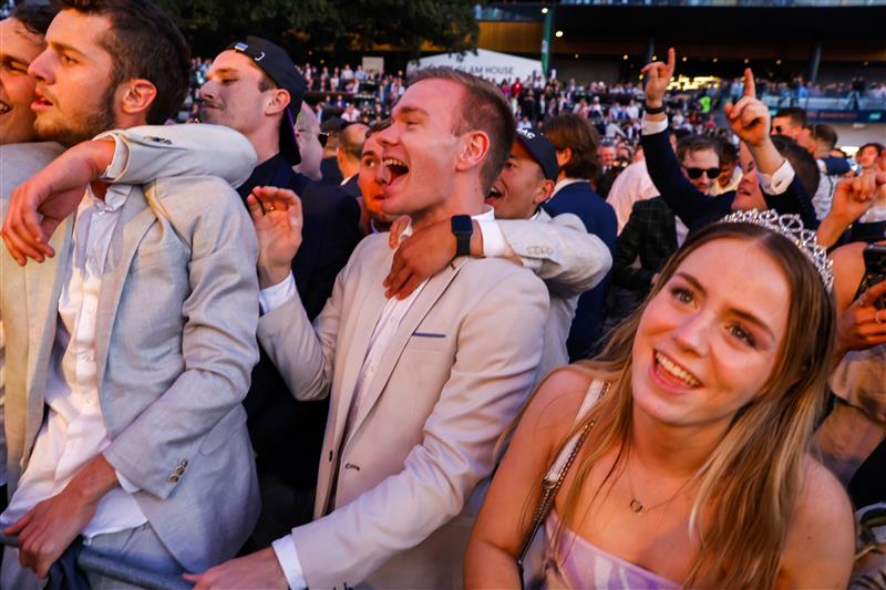 SYDNEY, AUSTRALIA - OCTOBER 01: Racegoers dance to a Queen cover band after the last race during Sydney Racing at Royal Randwick Racecourse on October 01, 2022 in Sydney, Australia. (Photo by Jenny Evans/Getty Images)