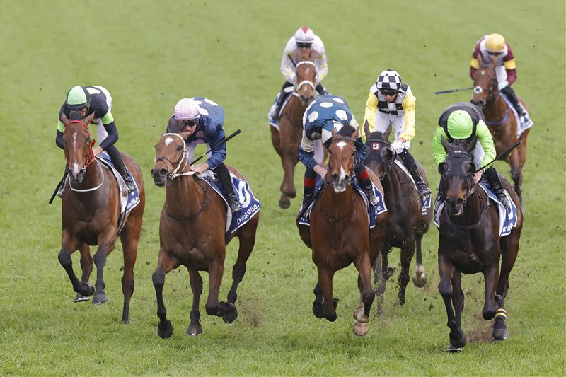 SYDNEY, AUSTRALIA - OCTOBER 01: Tommy Berry (pink cap) on No Compromise wins race 9 the Furphy Metropolitan during Sydney Racing at Royal Randwick Racecourse on October 01, 2022 in Sydney, Australia. (Photo by Jenny Evans/Getty Images)