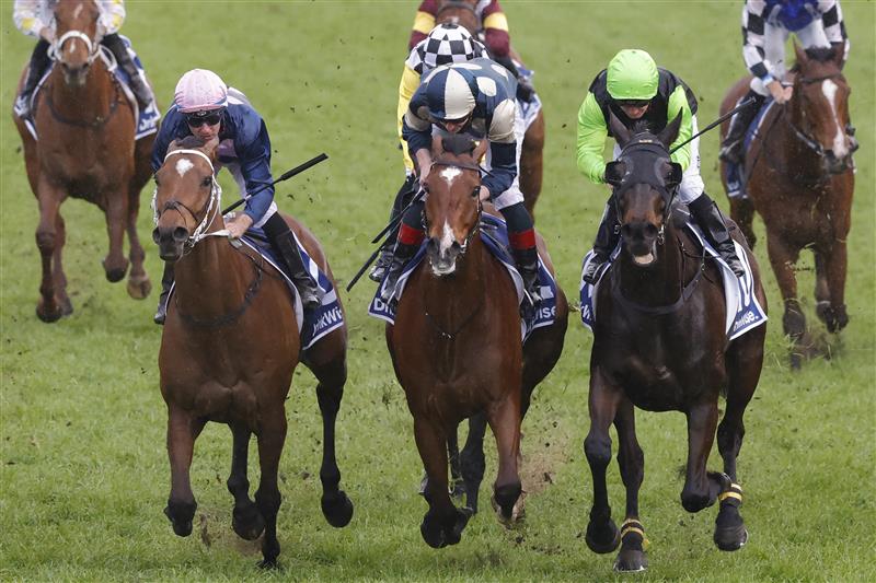 SYDNEY, AUSTRALIA - OCTOBER 01: Tommy Berry (pink cap) on No Compromise wins race 9 the Furphy Metropolitan during Sydney Racing at Royal Randwick Racecourse on October 01, 2022 in Sydney, Australia. (Photo by Jenny Evans/Getty Images)