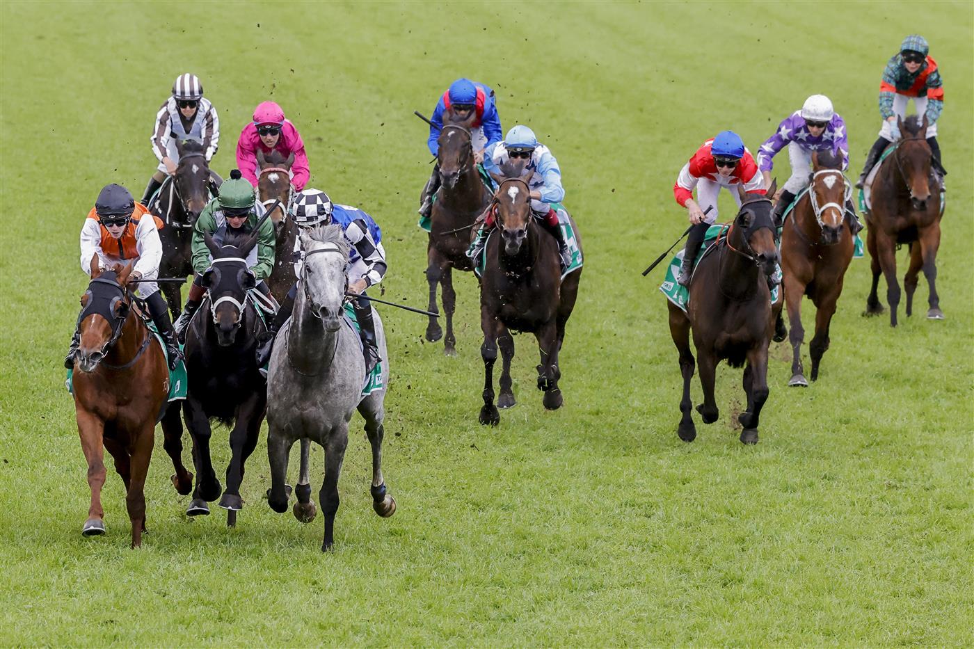 SYDNEY, AUSTRALIA - OCTOBER 01: Hugh Bowman on Top Ranked (grey horse) and Brenton Avdulla (orange) on Ellsberg are declared a dead heat in race 8 the Tab Epsom during Sydney Racing at Royal Randwick Racecourse on October 01, 2022 in Sydney, Australia. (Photo by Jenny Evans/Getty Images)