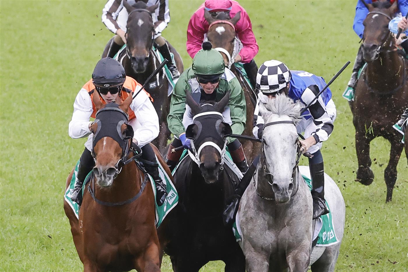SYDNEY, AUSTRALIA - OCTOBER 01: Hugh Bowman on Top Ranked (grey horse) and Brenton Avdulla (orange) on Ellsberg are declared a dead heat in race 8 the Tab Epsom during Sydney Racing at Royal Randwick Racecourse on October 01, 2022 in Sydney, Australia. (Photo by Jenny Evans/Getty Images)