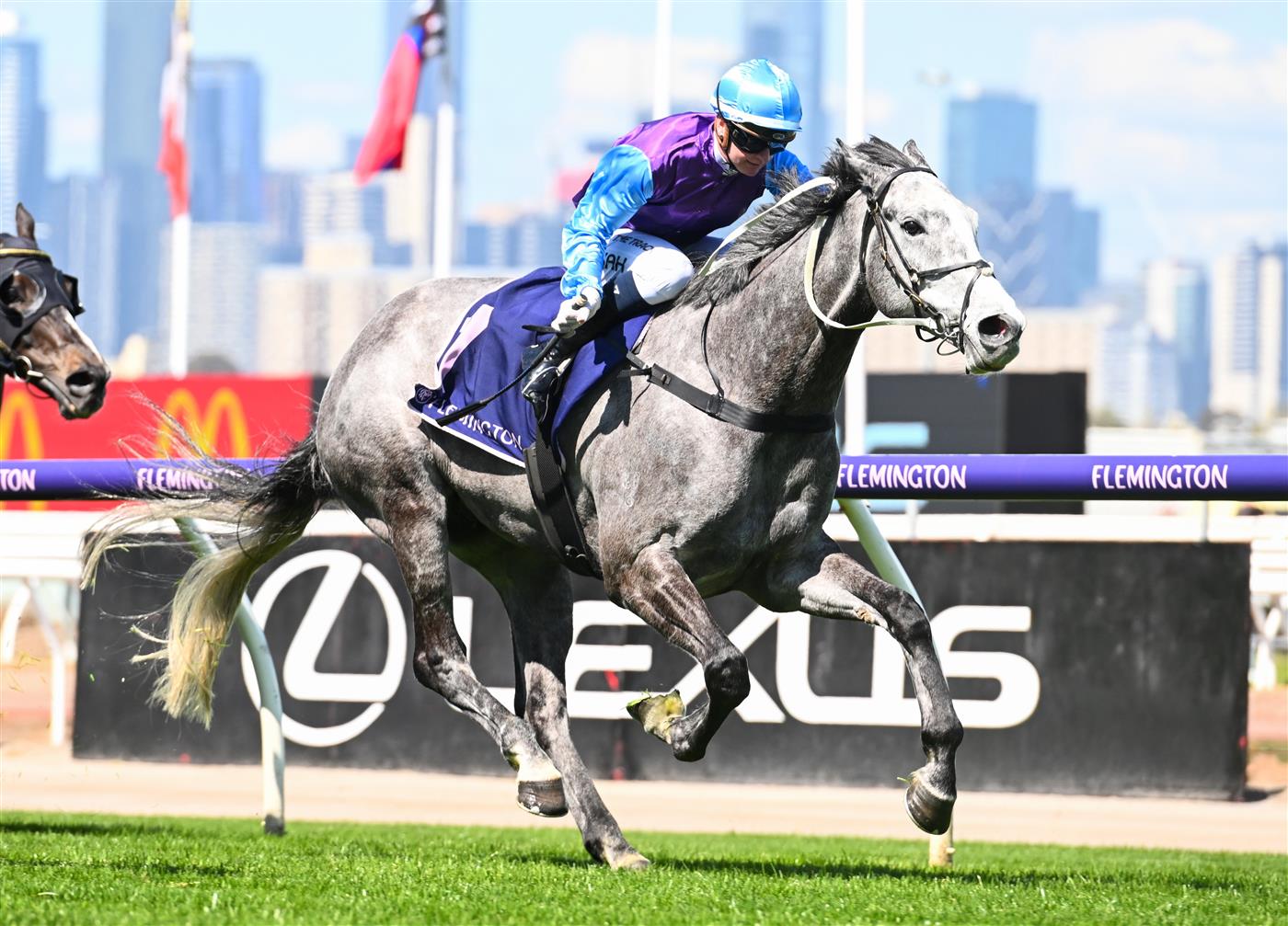 MELBOURNE, AUSTRALIA - OCTOBER 01: Jamie Kah riding Visinari winning Race 2, the Katherine Bourke Paris Lane Stakes, during Turnbull Stakes Day at Flemington Racecourse on October 01, 2022 in Melbourne, Australia. (Photo by Vince Caligiuri/Getty Images)