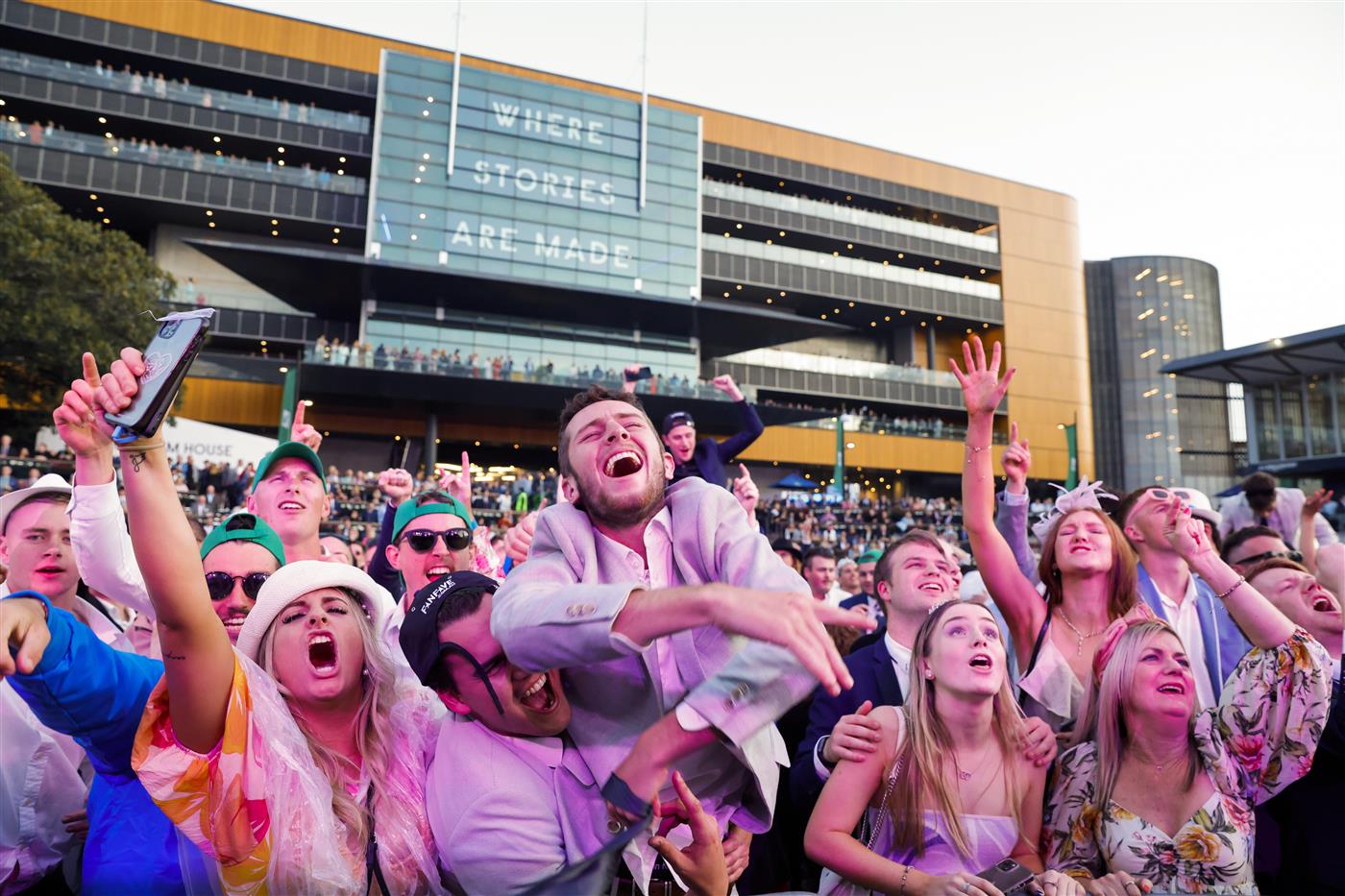 SYDNEY, AUSTRALIA - OCTOBER 01: Racegoers dance to a Queen cover band after the last race during Sydney Racing at Royal Randwick Racecourse on October 01, 2022 in Sydney, Australia. (Photo by Jenny Evans/Getty Images)