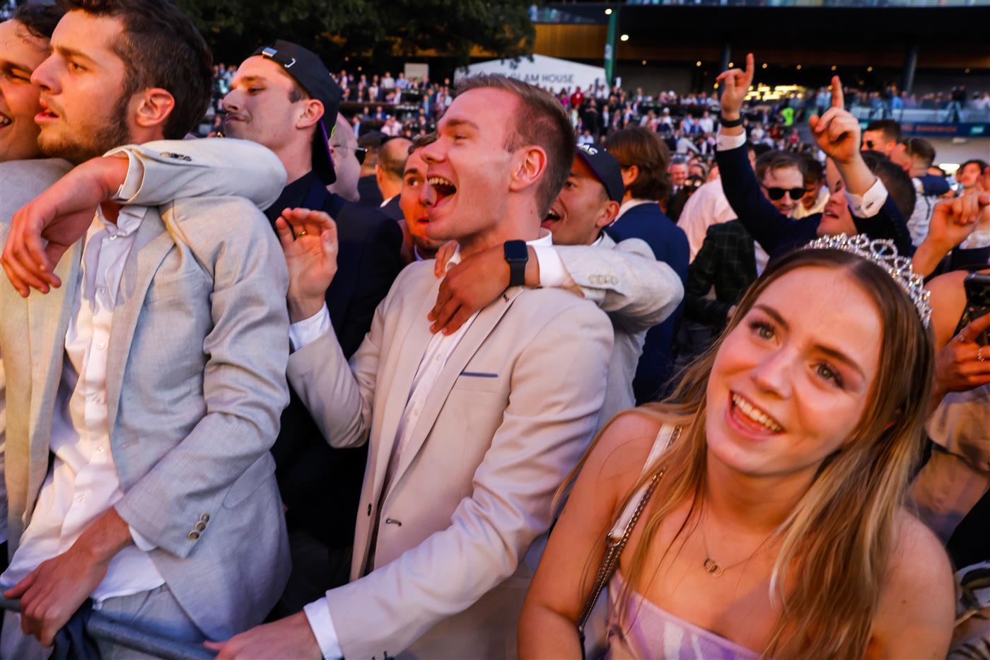 SYDNEY, AUSTRALIA - OCTOBER 01: Racegoers dance to a Queen cover band after the last race during Sydney Racing at Royal Randwick Racecourse on October 01, 2022 in Sydney, Australia. (Photo by Jenny Evans/Getty Images)