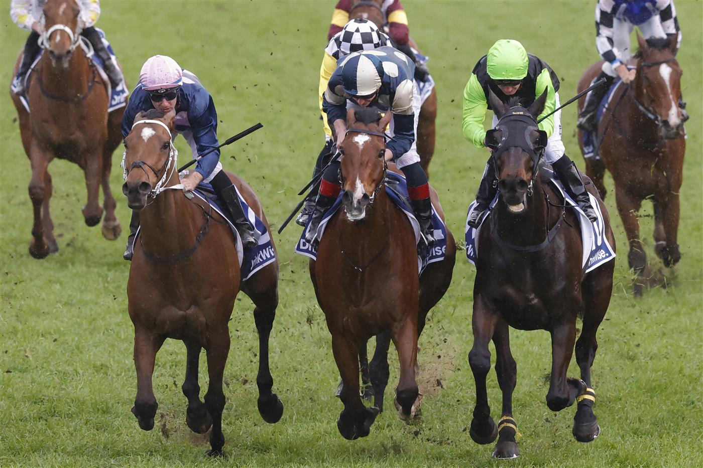SYDNEY, AUSTRALIA - OCTOBER 01: Tommy Berry (pink cap) on No Compromise wins race 9 the Furphy Metropolitan during Sydney Racing at Royal Randwick Racecourse on October 01, 2022 in Sydney, Australia. (Photo by Jenny Evans/Getty Images)