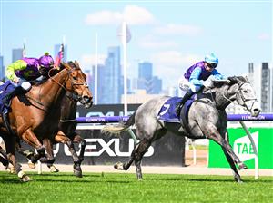 MELBOURNE, AUSTRALIA - OCTOBER 01: Jamie Kah riding Visinari winning Race 2, the Katherine Bourke Paris Lane Stakes, during Turnbull Stakes Day at Flemington Racecourse on October 01, 2022 in Melbourne, Australia. (Photo by Vince Caligiuri/Getty Images)