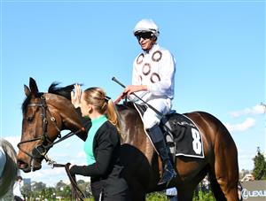 MELBOURNE, AUSTRALIA - OCTOBER 01: Michael Dee riding Lunar Flare after winning Race 6, the The Lexus Bart Cummings, during Turnbull Stakes Day at Flemington Racecourse on October 01, 2022 in Melbourne, Australia. (Photo by Vince Caligiuri/Getty Images)