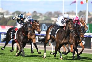 MELBOURNE, AUSTRALIA - OCTOBER 01: Michael Dee riding Lunar Flare winning Race 6, the The Lexus Bart Cummings, during Turnbull Stakes Day at Flemington Racecourse on October 01, 2022 in Melbourne, Australia. (Photo by Vince Caligiuri/Getty Images)
