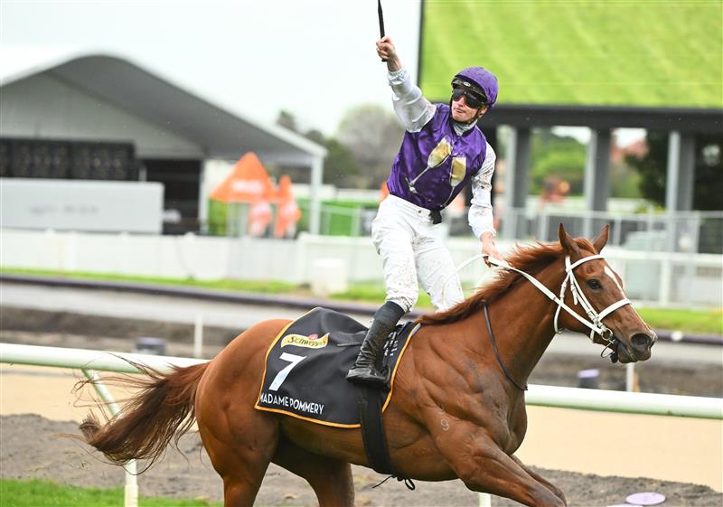 MELBOURNE, AUSTRALIA - OCTOBER 12: James McDonald riding Madame Pommery winning Race 8, the Schweppes Thousand Guineas, during Caulfield Thousand Guineas Day at Caulfield Racecourse on October 12, 2022 in Melbourne, Australia. (Photo by Vince Caligiuri/Getty Images)