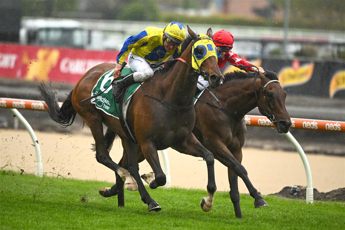 MELBOURNE, AUSTRALIA - OCTOBER 12: Ethan Brown riding Port Phillip (r) defeats Damien Oliver riding Kissinger in Race 2, the Evergreen Turf Handicap, during Caulfield Thousand Guineas Day at Caulfield Racecourse on October 12, 2022 in Melbourne, Australia. (Photo by Vince Caligiuri/Getty Images)