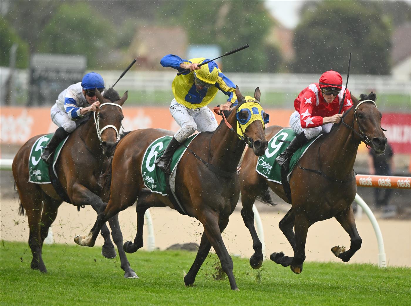MELBOURNE, AUSTRALIA - OCTOBER 12: Ethan Brown riding Port Phillip (r) defeats Damien Oliver riding Kissinger in Race 2, the Evergreen Turf Handicap, during Caulfield Thousand Guineas Day at Caulfield Racecourse on October 12, 2022 in Melbourne, Australia. (Photo by Vince Caligiuri/Getty Images)