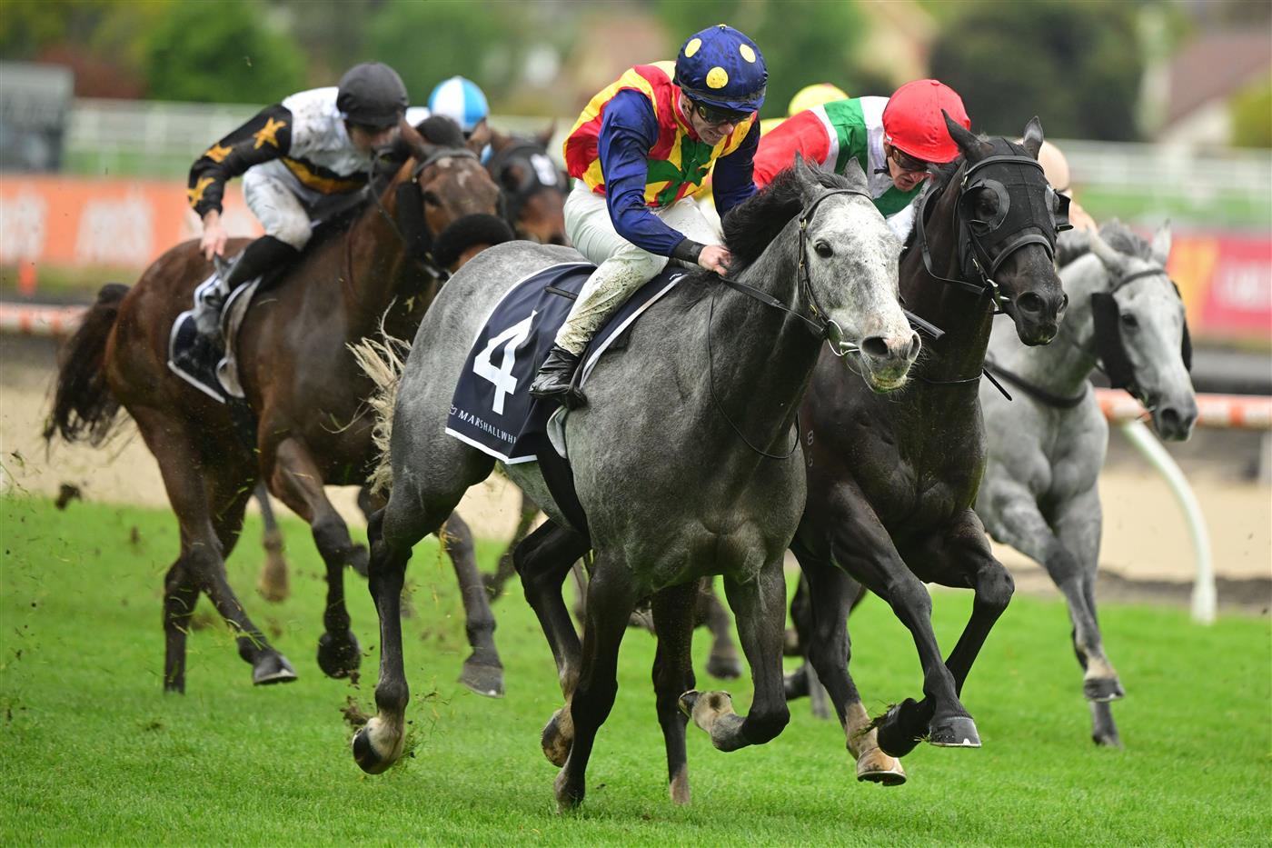 MELBOURNE, AUSTRALIA - OCTOBER 12: John Allen riding Ascension defeats Chad Schofield riding Eluding in Race 6, the Marshall White Trophy, during Caulfield Thousand Guineas Day at Caulfield Racecourse on October 12, 2022 in Melbourne, Australia. (Photo by Vince Caligiuri/Getty Images)