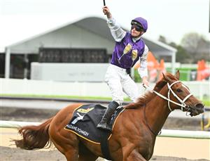 MELBOURNE, AUSTRALIA - OCTOBER 12: James McDonald riding Madame Pommery winning Race 8, the Schweppes Thousand Guineas, during Caulfield Thousand Guineas Day at Caulfield Racecourse on October 12, 2022 in Melbourne, Australia. (Photo by Vince Caligiuri/Getty Images)