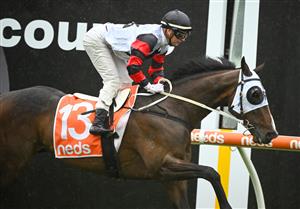 MELBOURNE, AUSTRALIA - OCTOBER 12: Jamie Kah riding Gunstock winning Race 3, the Neds Coongy Cup, during Caulfield Thousand Guineas Day at Caulfield Racecourse on October 12, 2022 in Melbourne, Australia. (Photo by Vince Caligiuri/Getty Images)
