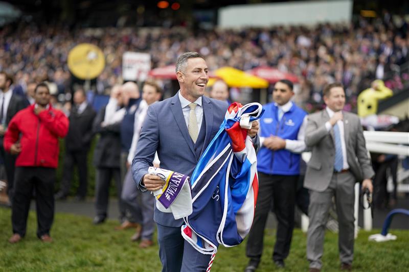 ASCOT, ENGLAND - OCTOBER 15: Stable staff react after Bay Bridge wins The Qipco Champion Stakes at Ascot Racecourse on October 15, 2022 in Ascot, England. (Photo by Alan Crowhurst/Getty Images)