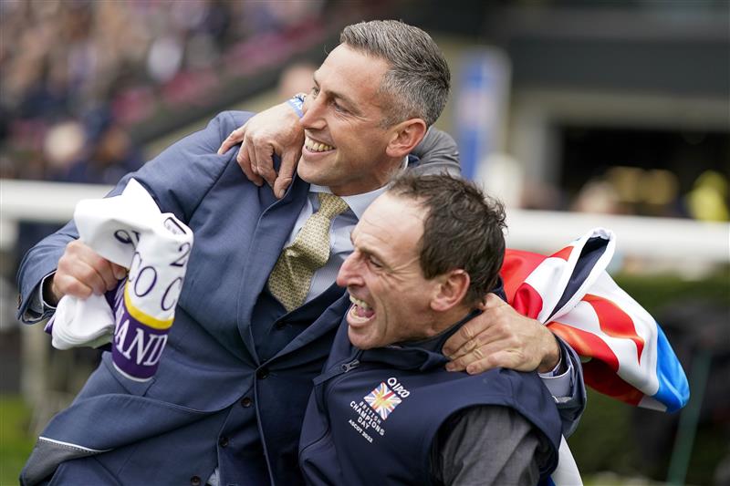 ASCOT, ENGLAND - OCTOBER 15: Stable staff react after Bay Bridge wins The Qipco Champion Stakes at Ascot Racecourse on October 15, 2022 in Ascot, England. (Photo by Alan Crowhurst/Getty Images)