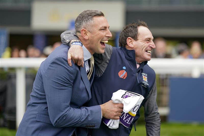 ASCOT, ENGLAND - OCTOBER 15: Stable staff react after Bay Bridge wins The Qipco Champion Stakes at Ascot Racecourse on October 15, 2022 in Ascot, England. (Photo by Alan Crowhurst/Getty Images)