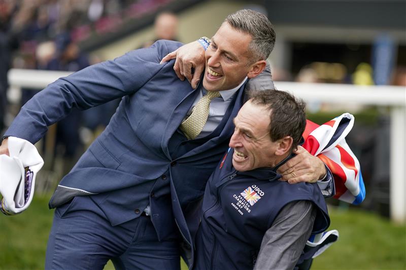 ASCOT, ENGLAND - OCTOBER 15: Stable staff react after Bay Bridge wins The Qipco Champion Stakes at Ascot Racecourse on October 15, 2022 in Ascot, England. (Photo by Alan Crowhurst/Getty Images)