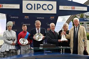 Sheikha Amna bint Abdulaziz Al Thani (L), British jockey Richard Kingscote (2nd L), trainer Michael Stoute (C), connections of Ballylinch Stud and owner James Wigan (R) pose at the presentation for the Champion Stakes on Qipco British Champions Day at Ascot Racecourse, west of London on October 15, 2022. - Champions day is the finale of the British flat racing season and the UK's richest raceday. (Photo by Glyn KIRK / AFP) (Photo by GLYN KIRK/AFP via Getty Images)