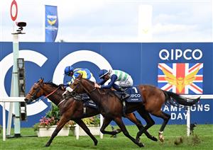 Jockey Hollie Doyle rides Trueshan (L) to victory over jockey David Probert on Coltrane in the Long Distance Cup on Qipco British Champions Day at Ascot Racecourse, west of London on October 15, 2022. - Champions day is the finale of the British flat racing season and the UK's richest raceday. (Photo by Glyn KIRK / AFP) (Photo by GLYN KIRK/AFP via Getty Images)