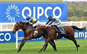 Jockey Hollie Doyle rides Trueshan (L) to victory over jockey David Probert on Coltrane in the Long Distance Cup on Qipco British Champions Day at Ascot Racecourse, west of London on October 15, 2022. - Champions day is the finale of the British flat racing season and the UK's richest raceday. (Photo by Glyn KIRK / AFP) (Photo by GLYN KIRK/AFP via Getty Images)