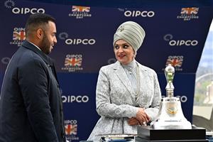 Sheikh Fahad Al-Thani (L) speaks with Sheikha Amna bint Abdulaziz Al Thani as they wait at the presentation for the Champion Stakes on Qipco British Champions Day at Ascot Racecourse, west of London on October 15, 2022. - Champions day is the finale of the British flat racing season and the UK's richest raceday. (Photo by Glyn KIRK / AFP) (Photo by GLYN KIRK/AFP via Getty Images)