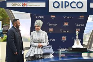 Sheikh Fahad Al-Thani (L) speaks with Sheikha Amna bint Abdulaziz Al Thani as they wait at the presentation for the Champion Stakes on Qipco British Champions Day at Ascot Racecourse, west of London on October 15, 2022. - Champions day is the finale of the British flat racing season and the UK's richest raceday. (Photo by Glyn KIRK / AFP) (Photo by GLYN KIRK/AFP via Getty Images)