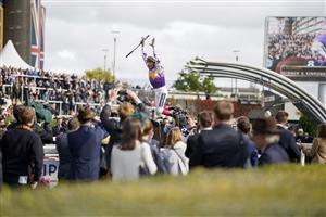 ASCOT, ENGLAND - OCTOBER 15: Frankie Dettori leaps from his mount after riding Kinross to win The Qipco British Champions Sprint Stakes at Ascot Racecourse on October 15, 2022 in Ascot, England. (Photo by Alan Crowhurst/Getty Images)