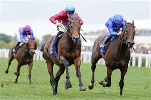 ASCOT, ENGLAND - OCTOBER 15: Richard Kingscote riding Bay Bridge (red) win The Qipco Champion Stakes at Ascot Racecourse on October 15, 2022 in Ascot, England. (Photo by Alan Crowhurst/Getty Images)