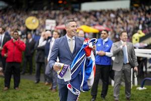 ASCOT, ENGLAND - OCTOBER 15: Stable staff react after Bay Bridge wins The Qipco Champion Stakes at Ascot Racecourse on October 15, 2022 in Ascot, England. (Photo by Alan Crowhurst/Getty Images)