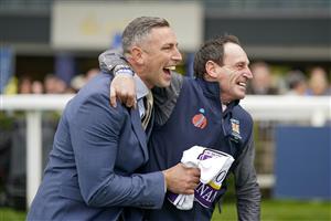 ASCOT, ENGLAND - OCTOBER 15: Stable staff react after Bay Bridge wins The Qipco Champion Stakes at Ascot Racecourse on October 15, 2022 in Ascot, England. (Photo by Alan Crowhurst/Getty Images)