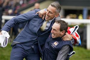 ASCOT, ENGLAND - OCTOBER 15: Stable staff react after Bay Bridge wins The Qipco Champion Stakes at Ascot Racecourse on October 15, 2022 in Ascot, England. (Photo by Alan Crowhurst/Getty Images)