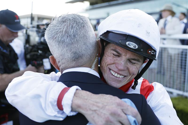 SYDNEY, AUSTRALIA - OCTOBER 15: Craig Williams hugs Corey Brown after winning The Everest on Giga Kick during Everest Day at Royal Randwick Racecourse on October 15, 2022 in Sydney, Australia. (Photo by Mark Evans/Getty Images)