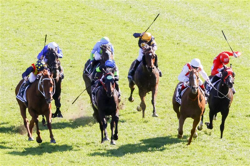 SYDNEY, AUSTRALIA - OCTOBER 15: Craig Williams (red and white) on Giga Kick wins race 7 The Tab Everest during Everest Day at Royal Randwick Racecourse on October 15, 2022 in Sydney, Australia. (Photo by Jenny Evans/Getty Images)
