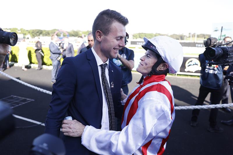 SYDNEY, AUSTRALIA - OCTOBER 15: Trainer Clayton Douglas and Craig Williams hug after winning The Everest with Giga Kick during Everest Day at Royal Randwick Racecourse on October 15, 2022 in Sydney, Australia. (Photo by Mark Evans/Getty Images)