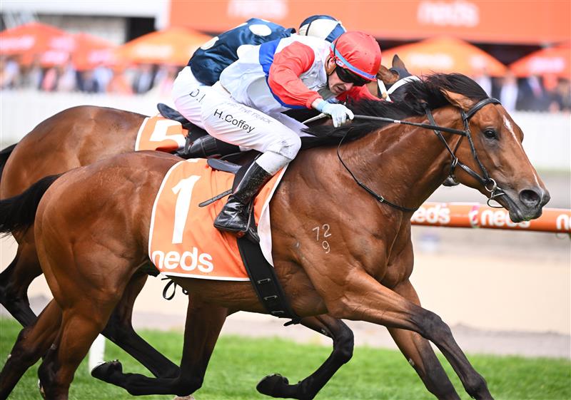 MELBOURNE, AUSTRALIA - OCTOBER 15: Harry Coffey riding Mr Maestro defeats Daniel Moor riding Muramasa in Race 3, the Neds Classic, during Caulfield Cup Day at Caulfield Racecourse on October 15, 2022 in Melbourne, Australia. (Photo by Vince Caligiuri/Getty Images)