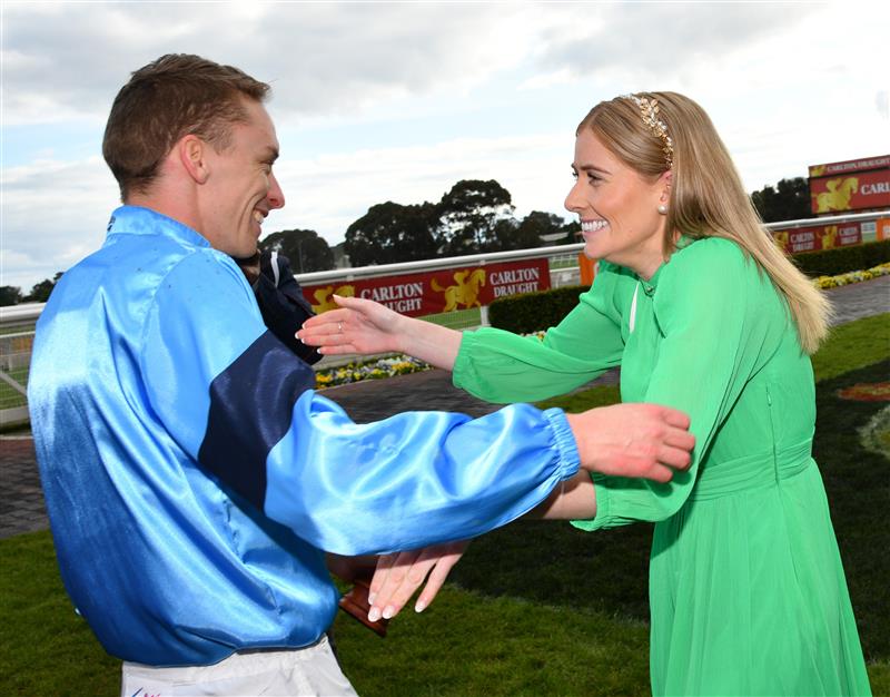 MELBOURNE, AUSTRALIA - OCTOBER 15: Michael Dee is congratulated by partner Mikaela Lawrence after riding Durston to win Race 9, the Carlton Draught Caulfield Cup, during Caulfield Cup Day at Caulfield Racecourse on October 15, 2022 in Melbourne, Australia. (Photo by Vince Caligiuri/Getty Images)