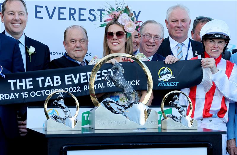Jockey Craig Williams (R), rider of the wining horse Giga Kick, celebrates victory with the Everest 2022 horse race trophy at the Royal Randwick race course in Sydney on October 15, 2022. - XGTY-- IMAGE RESTRICTED TO EDITORIAL USE - STRICTLY NO COMMERCIAL USE -- (Photo by DAVID GRAY / AFP) / XGTY-- IMAGE RESTRICTED TO EDITORIAL USE - STRICTLY NO COMMERCIAL USE -- (Photo by DAVID GRAY/AFP via Getty Images)