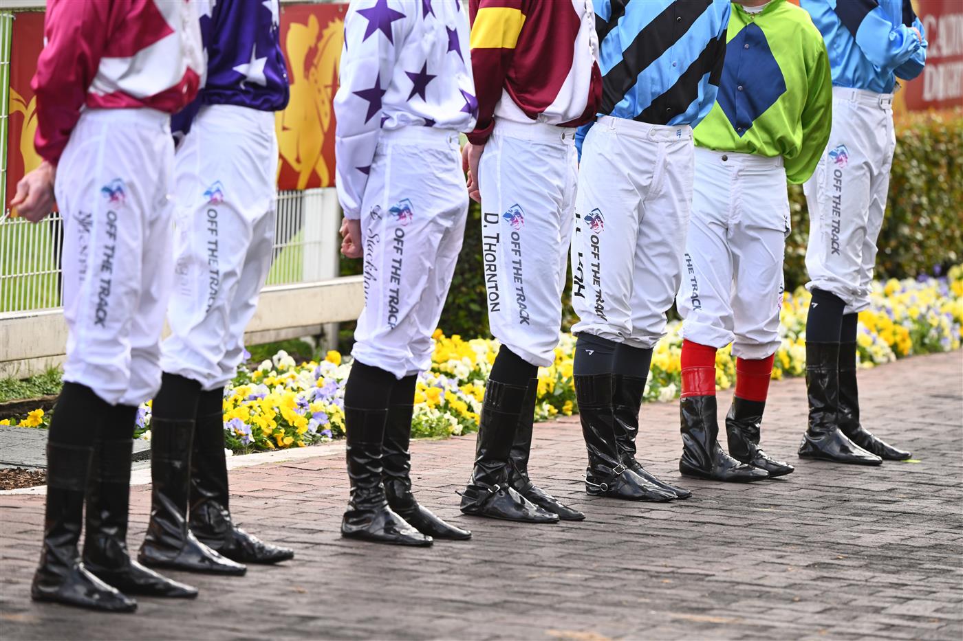 MELBOURNE, AUSTRALIA - OCTOBER 15: Jockeys pose ahead of Race 9, the Carlton Draught Caulfield Cup, during Caulfield Cup Day at Caulfield Racecourse on October 15, 2022 in Melbourne, Australia. (Photo by Vince Caligiuri/Getty Images)
