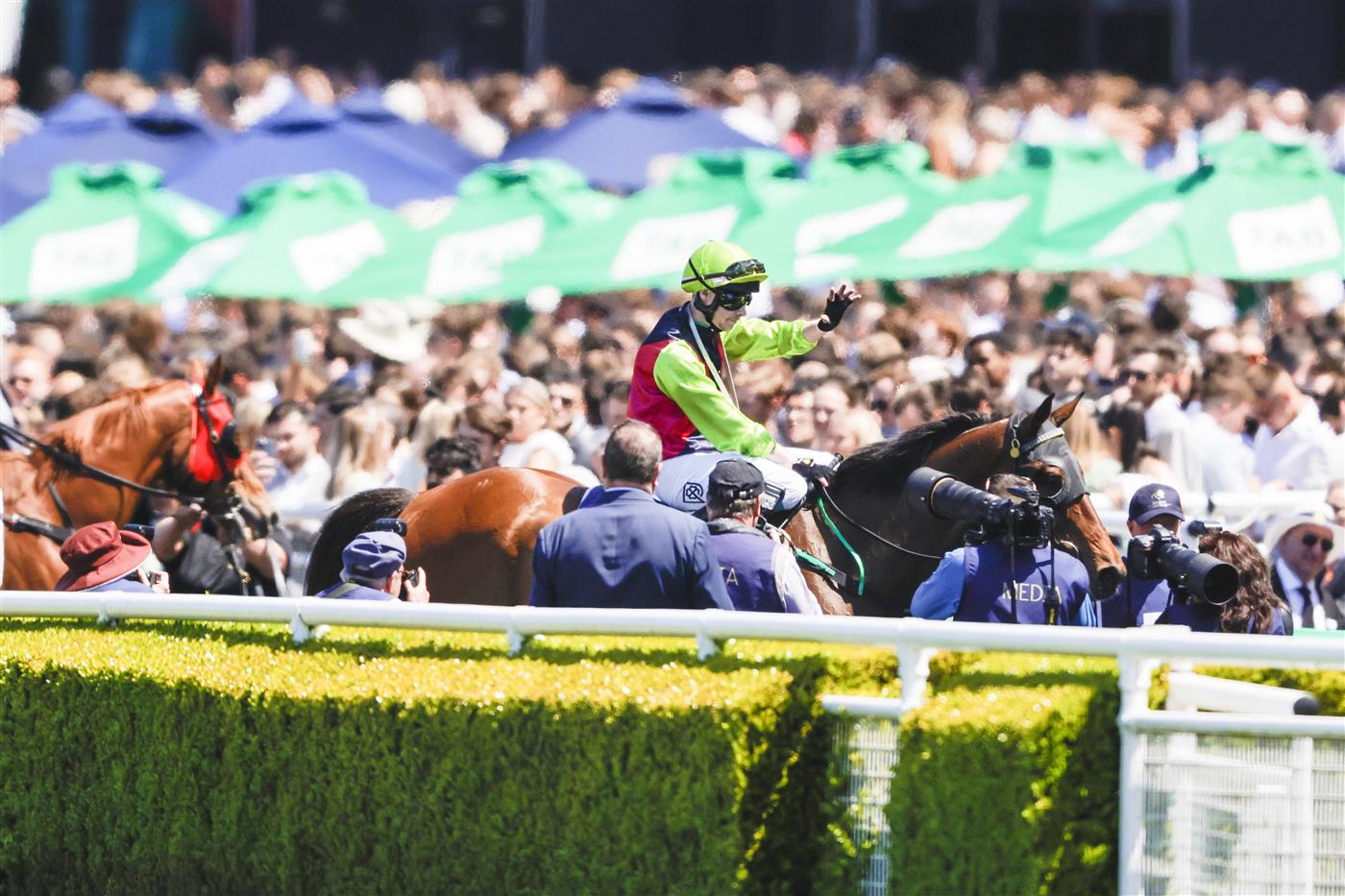 SYDNEY, AUSTRALIA - OCTOBER 15: Robbie Dolan (lime cap) on Cisco Bay returns to scale after winning race 2 the Big Dance Wild Card during Everest Day at Royal Randwick Racecourse on October 15, 2022 in Sydney, Australia. (Photo by Jenny Evans/Getty Images)