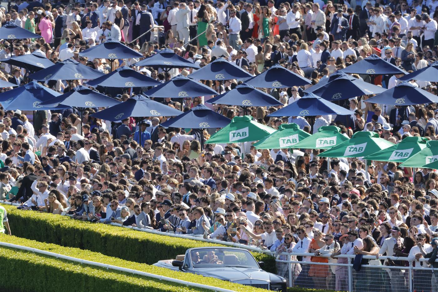 SYDNEY, AUSTRALIA - OCTOBER 15: Australian swimming champion Emma McKeon delivers the Everest trophy during Everest Day at Royal Randwick Racecourse on October 15, 2022 in Sydney, Australia. (Photo by Jenny Evans/Getty Images)
