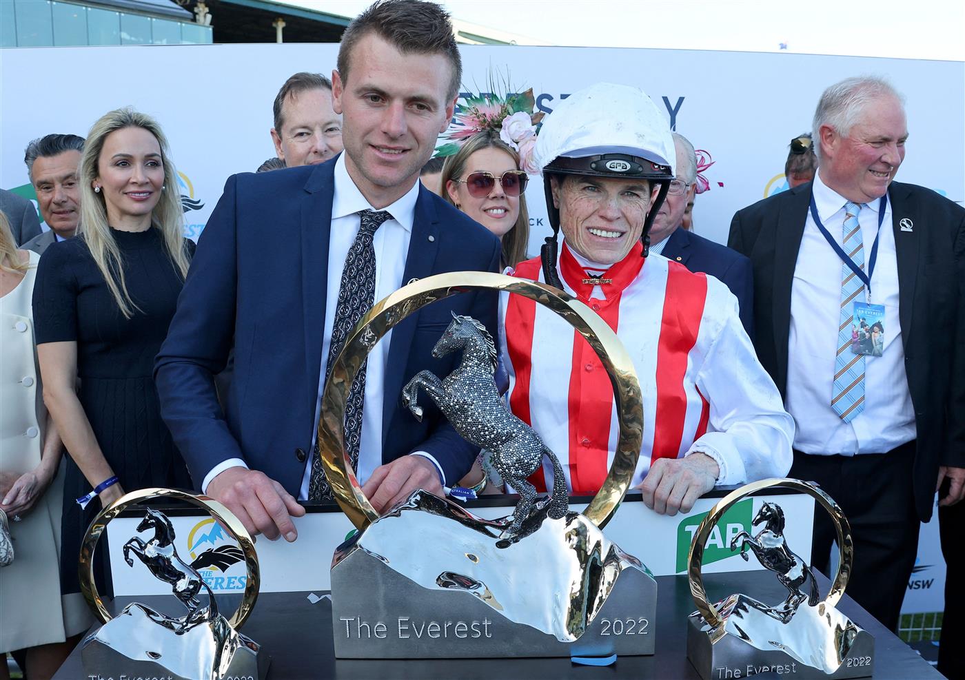 Trainer Clayton Douglas (L) and jockey Craig Williams of Giga Kick pose with the Everest 2022 horse race trophy at the Royal Randwick race course in Sydney on October 15, 2022. - XGTY-- IMAGE RESTRICTED TO EDITORIAL USE - STRICTLY NO COMMERCIAL USE -- (Photo by DAVID GRAY / AFP) / XGTY-- IMAGE RESTRICTED TO EDITORIAL USE - STRICTLY NO COMMERCIAL USE -- (Photo by DAVID GRAY/AFP via Getty Images)