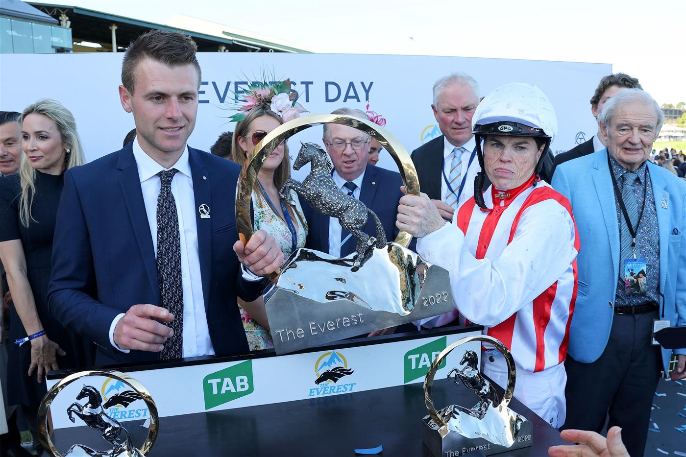 Trainer Clayton Douglas (L) and jockey Craig Williams of Giga Kick lift the Everest 2022 horse race trophy at the Royal Randwick race course in Sydney on October 15, 2022. - XGTY-- IMAGE RESTRICTED TO EDITORIAL USE - STRICTLY NO COMMERCIAL USE -- (Photo by DAVID GRAY / AFP) / XGTY-- IMAGE RESTRICTED TO EDITORIAL USE - STRICTLY NO COMMERCIAL USE -- (Photo by DAVID GRAY/AFP via Getty Images)