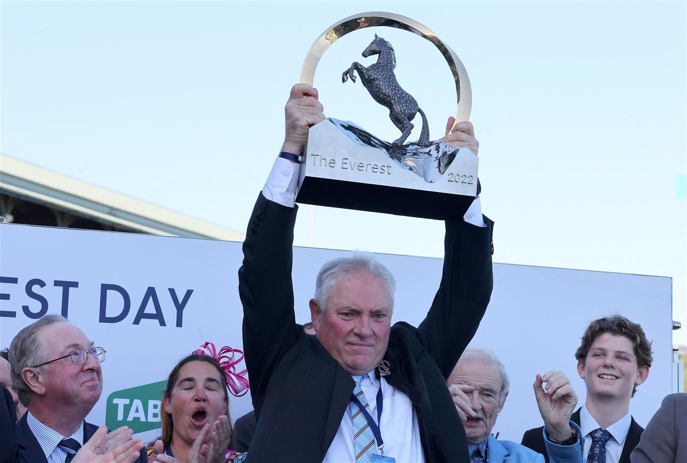 Rod Douglas, racing manager of the winner horse Giga Kick, lifts the Everest 2022 horse race trophy at the Royal Randwick race course in Sydney on October 15, 2022. - XGTY-- IMAGE RESTRICTED TO EDITORIAL USE - STRICTLY NO COMMERCIAL USE -- (Photo by DAVID GRAY / AFP) / XGTY-- IMAGE RESTRICTED TO EDITORIAL USE - STRICTLY NO COMMERCIAL USE -- (Photo by DAVID GRAY/AFP via Getty Images)