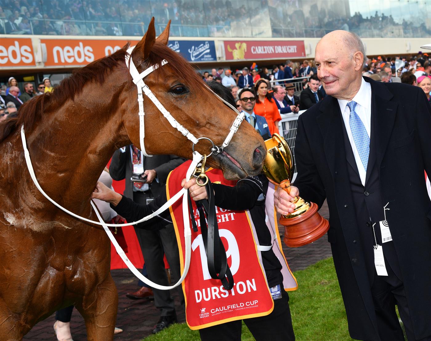 MELBOURNE, AUSTRALIA - OCTOBER 15: Part owner,  Peter Barnett poses with Durston after winning Race 9, the Carlton Draught Caulfield Cup, during Caulfield Cup Day at Caulfield Racecourse on October 15, 2022 in Melbourne, Australia. (Photo by Vince Caligiuri/Getty Images)