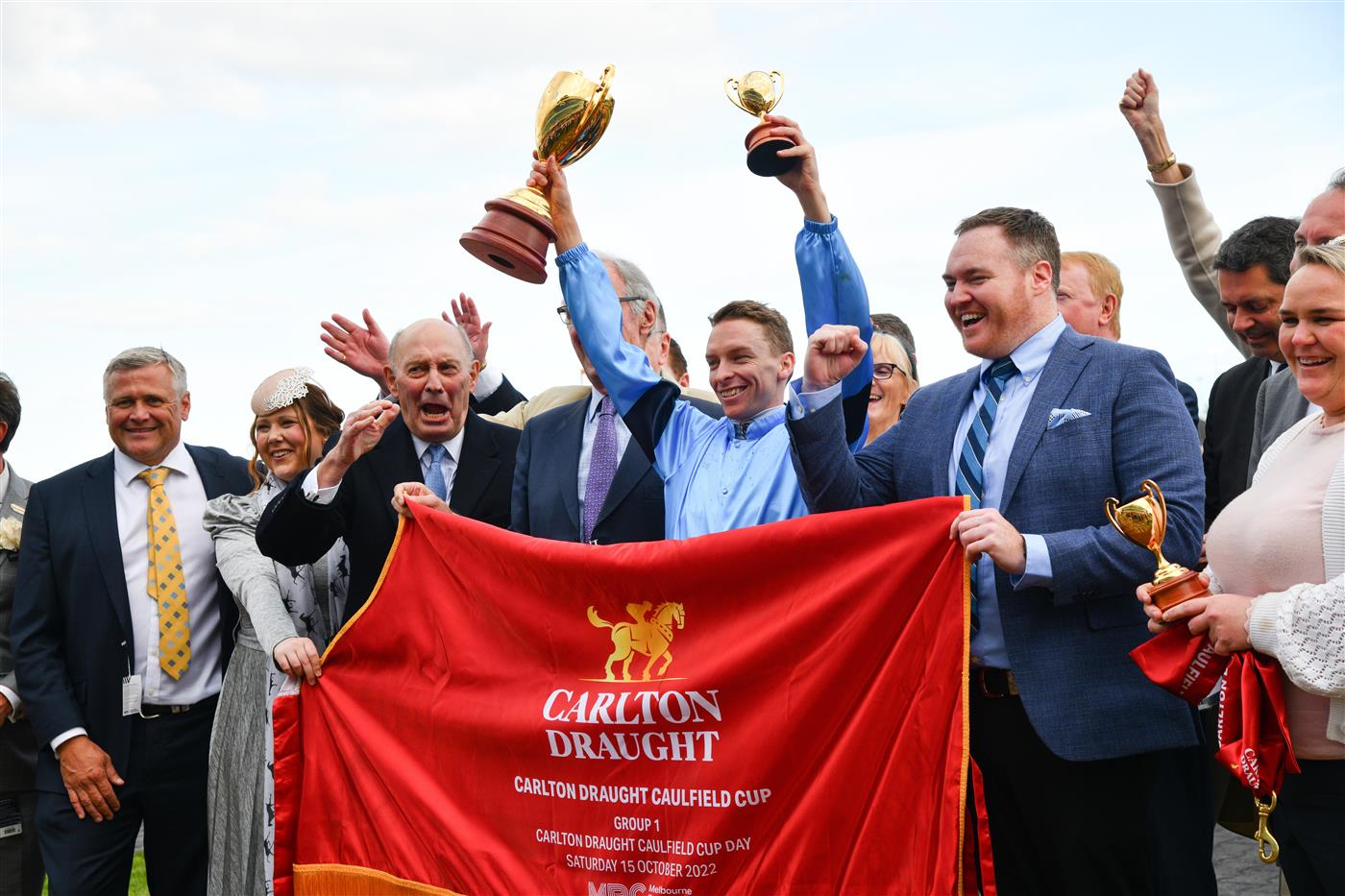 MELBOURNE, AUSTRALIA - OCTOBER 15: Michael Dee poses with trophy after riding Durston to win Race 9, the Carlton Draught Caulfield Cup, during Caulfield Cup Day at Caulfield Racecourse on October 15, 2022 in Melbourne, Australia. (Photo by Vince Caligiuri/Getty Images)