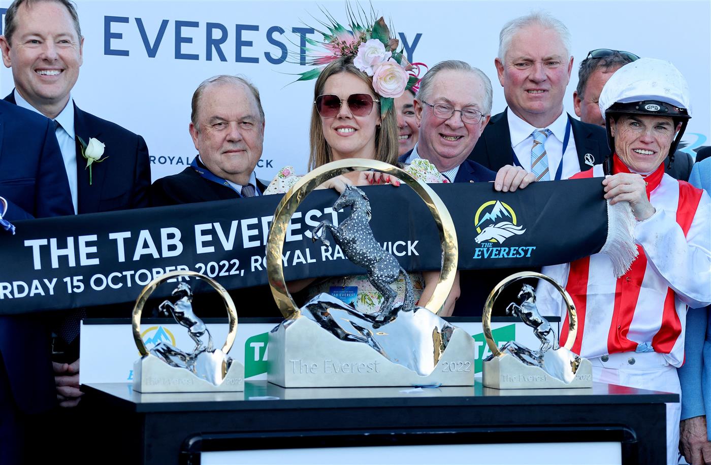 Jockey Craig Williams (R), rider of the wining horse Giga Kick, celebrates victory with the Everest 2022 horse race trophy at the Royal Randwick race course in Sydney on October 15, 2022. - XGTY-- IMAGE RESTRICTED TO EDITORIAL USE - STRICTLY NO COMMERCIAL USE -- (Photo by DAVID GRAY / AFP) / XGTY-- IMAGE RESTRICTED TO EDITORIAL USE - STRICTLY NO COMMERCIAL USE -- (Photo by DAVID GRAY/AFP via Getty Images)
