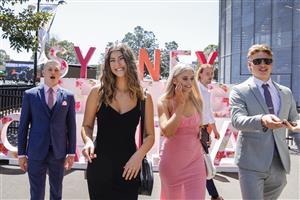SYDNEY, AUSTRALIA - OCTOBER 15: Race-goers pose for photos at a Sydney Spring Racing display during Everest Day at Royal Randwick Racecourse on October 15, 2022 in Sydney, Australia. (Photo by Jenny Evans/Getty Images)