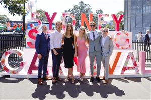 SYDNEY, AUSTRALIA - OCTOBER 15: Race-goers pose for photos at a Sydney Spring Racing display during Everest Day at Royal Randwick Racecourse on October 15, 2022 in Sydney, Australia. (Photo by Jenny Evans/Getty Images)